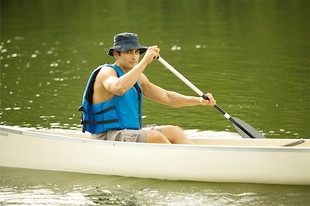 simsearch:625-00805928,k - Portrait of a mid adult man boating in a river Stock Photo - Premium Royalty-Free, Code: 625-00902746