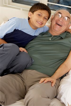 simsearch:400-06142278,k - Portrait of a boy and his grandfather on a couch Stock Photo - Premium Royalty-Free, Code: 625-00903051
