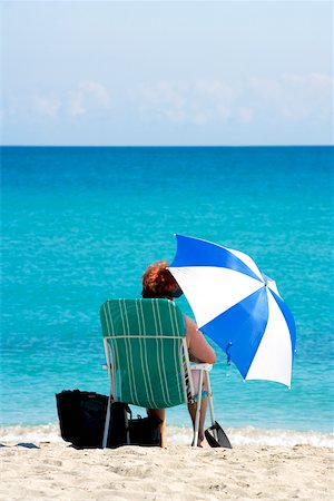 simsearch:625-00903103,k - Rear view of a woman sitting on the beach, South Beach, Miami, Florida, USA Stock Photo - Premium Royalty-Free, Code: 625-00903229