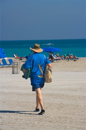 simsearch:625-00903103,k - Rear view of a man walking on the beach, South Beach, Miami, Florida, USA Stock Photo - Premium Royalty-Free, Code: 625-00903244