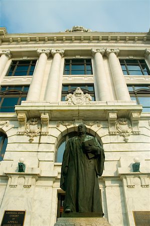 Low angle view of the statue of a judge in front of a courthouse, New Orleans, Louisiana, USA Stock Photo - Premium Royalty-Free, Code: 625-00903529