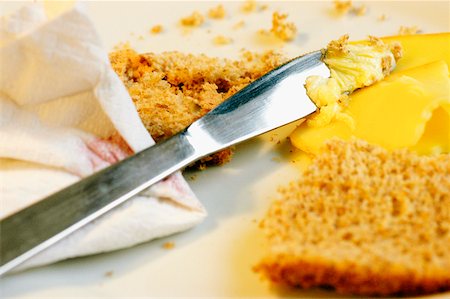 simsearch:625-01261270,k - Close-up of a table knife with brown bread and cheese Stock Photo - Premium Royalty-Free, Code: 625-01038628