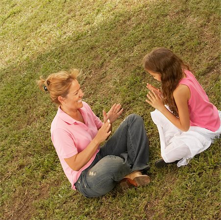 High angle view of a mature woman playing with her daughter in the park Stock Photo - Premium Royalty-Free, Code: 625-01039408