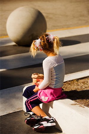 High view  of a girl sitting Stock Photo - Premium Royalty-Free, Code: 625-01039930