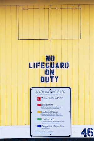 Close-up of a warning sign on a lifeguard hut Stock Photo - Premium Royalty-Free, Code: 625-01039971