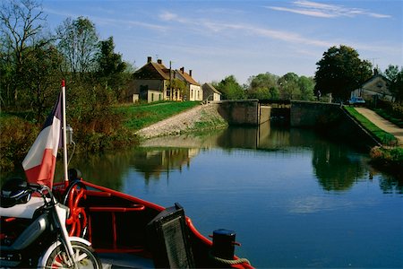 Luxury cruise barge transporting goods over a river, France Stock Photo - Premium Royalty-Free, Code: 625-01040658