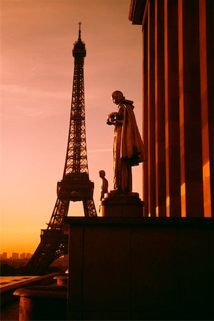 paris sunrise - Eiffel Tower seen at the back of a palace statue at sunset, Paris, France Stock Photo - Premium Royalty-Free, Code: 625-01040652