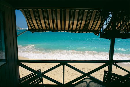 saint martin caribbean - View of a calm beach from the deck of a seaside restaurant, St. Maarten, Caribbean Stock Photo - Premium Royalty-Free, Code: 625-01040897