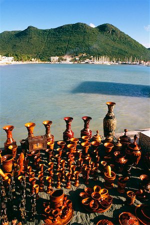 saint martin caribbean - A variety of wooden souvenirs are displayed on a seashore, St. Maarten, Caribbean Stock Photo - Premium Royalty-Free, Code: 625-01040915