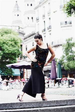 dancing on tables - Young woman dancing on the sidewalk Stock Photo - Premium Royalty-Free, Code: 625-01096323