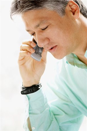 Close-up of a senior man talking on a mobile phone Stock Photo - Premium Royalty-Free, Code: 625-01097490