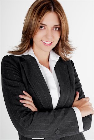 simsearch:625-01097830,k - Portrait of a businesswoman smiling with her arms folded Stock Photo - Premium Royalty-Free, Code: 625-01097557