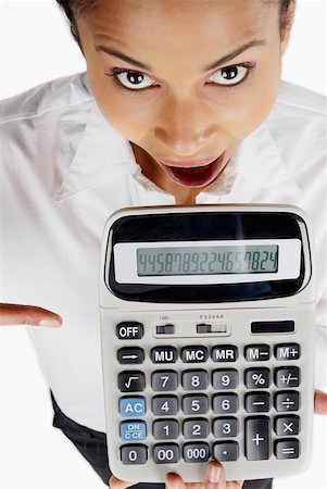 simsearch:625-01097830,k - Portrait of a businesswoman holding a calculator with her mouth open Stock Photo - Premium Royalty-Free, Code: 625-01097778