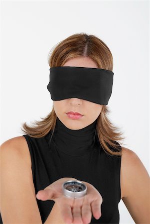simsearch:625-01097830,k - Close-up of a businesswoman showing a compass with her eyes blindfolded Stock Photo - Premium Royalty-Free, Code: 625-01097789