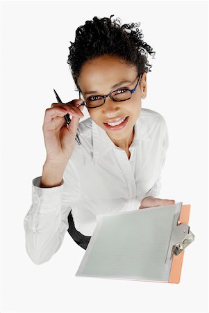 simsearch:625-01097830,k - High angle view of a businesswoman holding a clipboard and smiling Stock Photo - Premium Royalty-Free, Code: 625-01097809