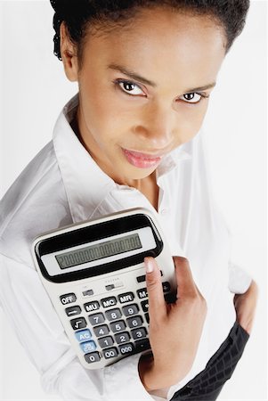 simsearch:625-01097830,k - Portrait of a businesswoman holding a calculator Stock Photo - Premium Royalty-Free, Code: 625-01097803