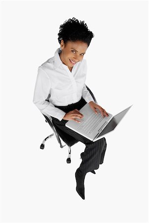 simsearch:625-01097830,k - High angle view of a businesswoman using a laptop Stock Photo - Premium Royalty-Free, Code: 625-01097820