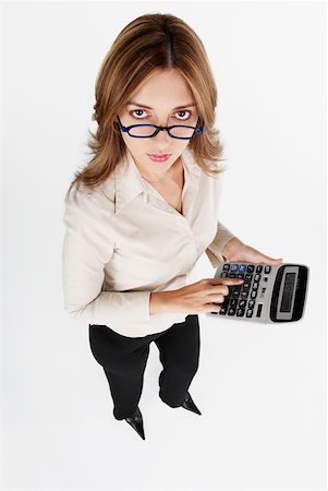 simsearch:625-01097830,k - High angle view of a businesswoman using a calculator Stock Photo - Premium Royalty-Free, Code: 625-01097830
