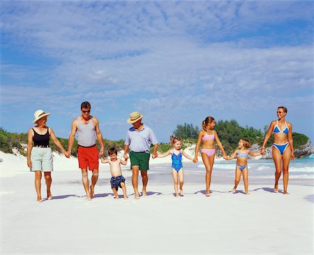 elderly women in bathing suits - Three generation family walking on the beach with holding hands, Bermuda Stock Photo - Premium Royalty-Free, Code: 625-01092048