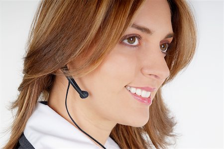 simsearch:625-01097830,k - Side profile of a businesswoman with a hands free device Stock Photo - Premium Royalty-Free, Code: 625-01093712