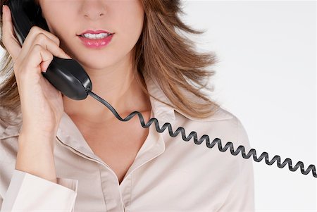 simsearch:625-01097830,k - Mid section view of a businesswoman talking on the telephone Stock Photo - Premium Royalty-Free, Code: 625-01093726
