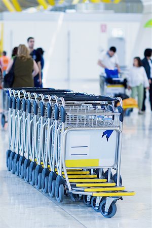 Close-up of luggage carts at an airport, Madrid, Spain Stock Photo - Premium Royalty-Free, Code: 625-01250837