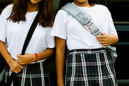 Mid section view of two schoolgirls Stock Photo - Premium Royalty-Free, Code: 625-01250849