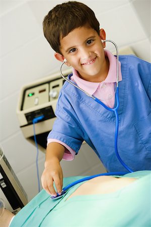 simsearch:625-01249642,k - Portrait of a boy imitating a doctor and examining a patient with a stethoscope Foto de stock - Sin royalties Premium, Código: 625-01251126