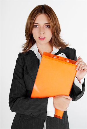 simsearch:625-01097830,k - Portrait of a businesswoman holding a clipboard Stock Photo - Premium Royalty-Free, Code: 625-01265126