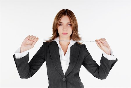 simsearch:625-01097830,k - Portrait of a businesswoman holding a chain Stock Photo - Premium Royalty-Free, Code: 625-01261584