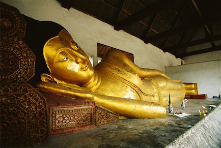 Close-up of a statue of reclining Buddha in a temple, Chiang Mai, Bangkok, Thailand Stock Photo - Premium Royalty-Free, Code: 625-01261994
