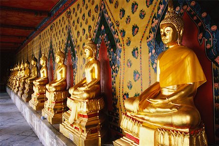 Row of statues of Buddha in a temple, Wat Arun, Bangkok, Thailand Stock Photo - Premium Royalty-Free, Code: 625-01262234