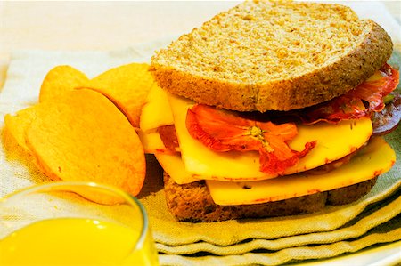 simsearch:625-01261270,k - Close-up of a sandwich with potato chips on a napkin Stock Photo - Premium Royalty-Free, Code: 625-01262484