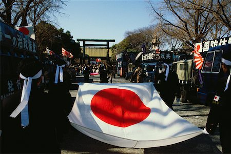 Rear view of four people carrying a Japanese flag, Yasukuni Shrine, Tokyo Prefecture, Japan Stock Photo - Premium Royalty-Free, Code: 625-01262650