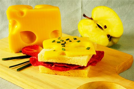 simsearch:625-01261270,k - Close-up of a sandwich with slices of cheese on a cutting board Stock Photo - Premium Royalty-Free, Code: 625-01263051