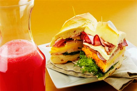 simsearch:625-01261270,k - Close-up of roast beef and cheese sandwiches near a bottle of fruit juice Stock Photo - Premium Royalty-Free, Code: 625-01263283