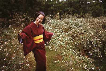 Young woman smiling in traditional Japanese clothing, Kamakura, Kanagawa Prefecture, Japan Stock Photo - Premium Royalty-Free, Code: 625-01263554