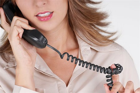 simsearch:625-01097830,k - Mid section view of a businesswoman talking on the telephone Stock Photo - Premium Royalty-Free, Code: 625-01263871