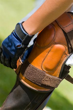 riding boots not equestrian not cowboy not child - Close-up of a person tying a riding boot Stock Photo - Premium Royalty-Free, Code: 625-01744556