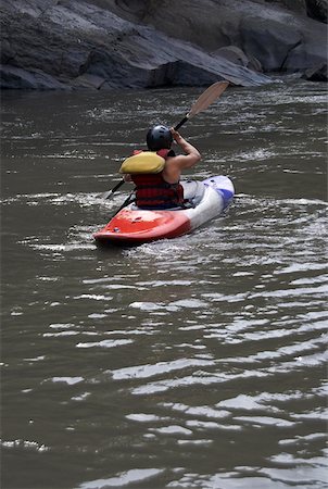 simsearch:625-00801301,k - Rear view of a person kayaking in a river Stock Photo - Premium Royalty-Free, Code: 625-01744783