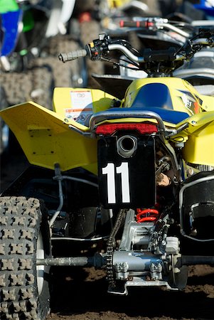 Close-up of quadbikes in a row Stock Photo - Premium Royalty-Free, Code: 625-01744895