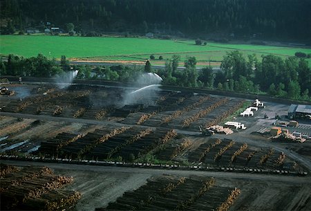 sawmill - Watering logs to reduce heat buildup, sawmill, Idaho Stock Photo - Premium Royalty-Free, Code: 625-01746044