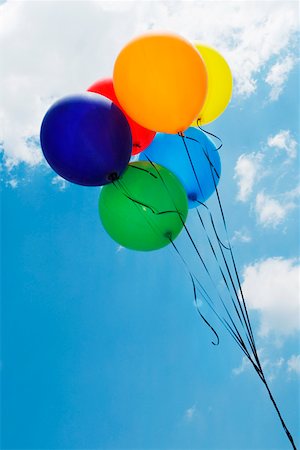 Low angle view of balloons in the sky forming a rainbow flag Stock Photo - Premium Royalty-Free, Code: 625-01746323