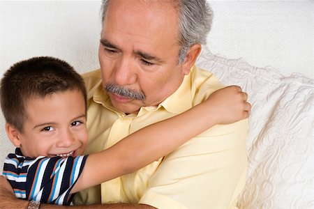 simsearch:630-03479683,k - Portrait of a boy hugging his grandfather Stock Photo - Premium Royalty-Free, Code: 625-01746362