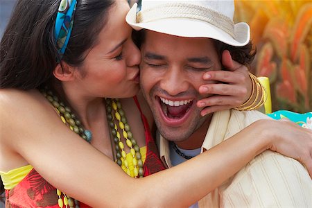 Close-up of a young woman kissing a young man Stock Photo - Premium Royalty-Free, Code: 625-01747548