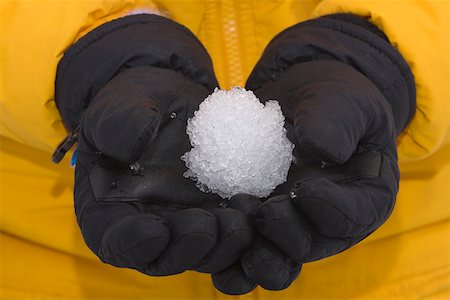 snow ball - Mid section view of a person holding a snowball Stock Photo - Premium Royalty-Free, Code: 625-01747927