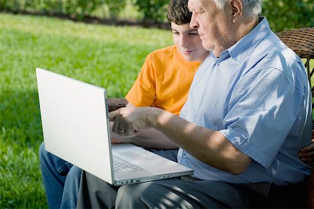 Senior man with his grandson using a laptop Stock Photo - Premium Royalty-Free, Code: 625-01748208