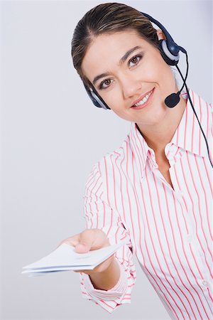 switchboard operator - Portrait of a businesswoman holding documents and smiling Stock Photo - Premium Royalty-Free, Code: 625-01748280
