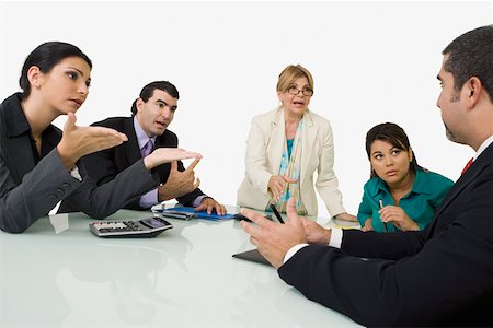 simsearch:625-01097830,k - Five business executives discussing in a meeting Stock Photo - Premium Royalty-Free, Code: 625-01748292