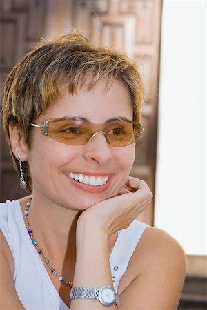 Close-up of a mid adult woman smiling Stock Photo - Premium Royalty-Free, Code: 625-01749308